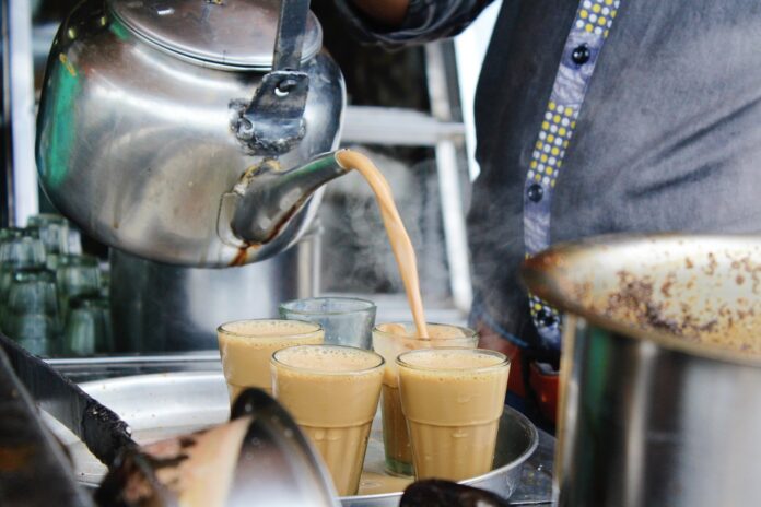 Men,Pours,Cup,Hot,Tea,Indian,Style,Or,Chai,For